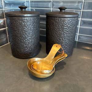 Black Canisters and Golden Spoons - G429