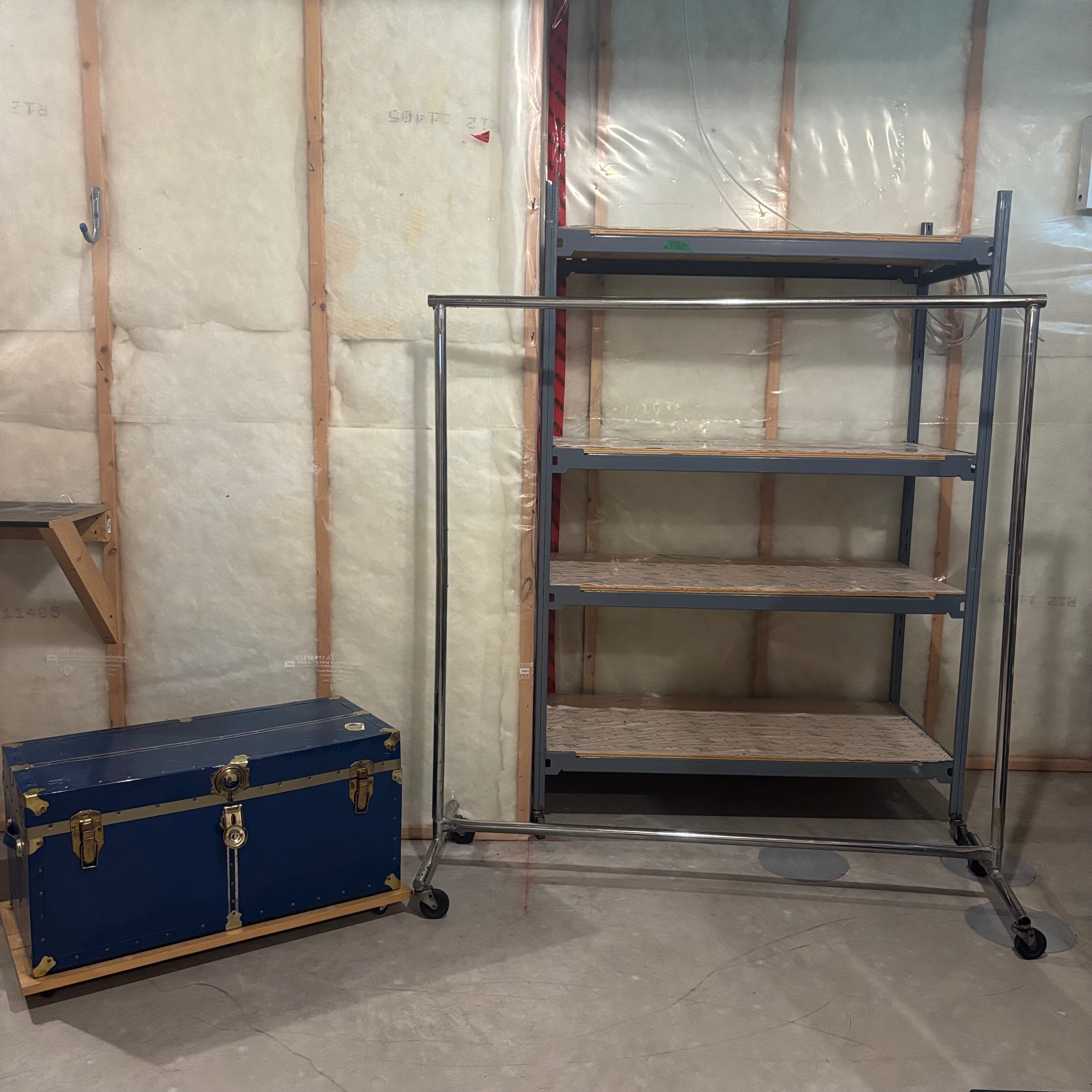 E869 Heavy duty metal clothing rack and vintage chest (shelf behind is not included)