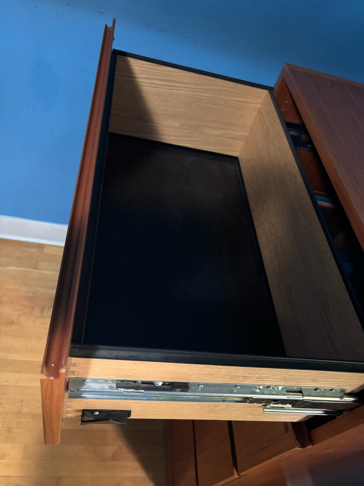 E332 Wood paneled 4 drawer file cabinet (49" x 32" x 20")