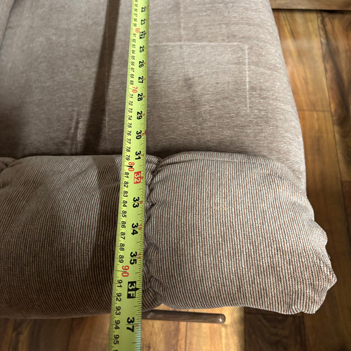 F188 Rocker recliner in beige corduroy fabric (in excellent condition except for a small tear in the corner)