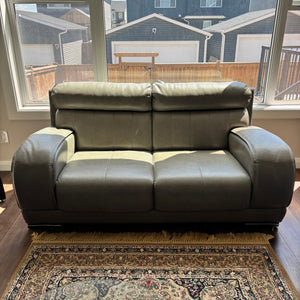 Grey Leather love seat (chrome trim on leg is pealing)  - R503