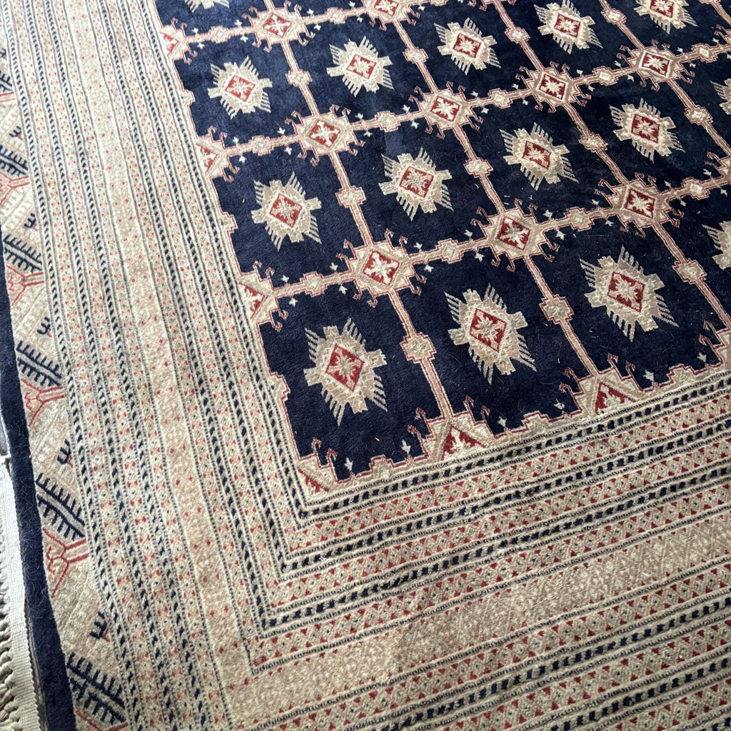E129 109” x 150” Vintage wool rug with underlay (fringe is mostly separated)