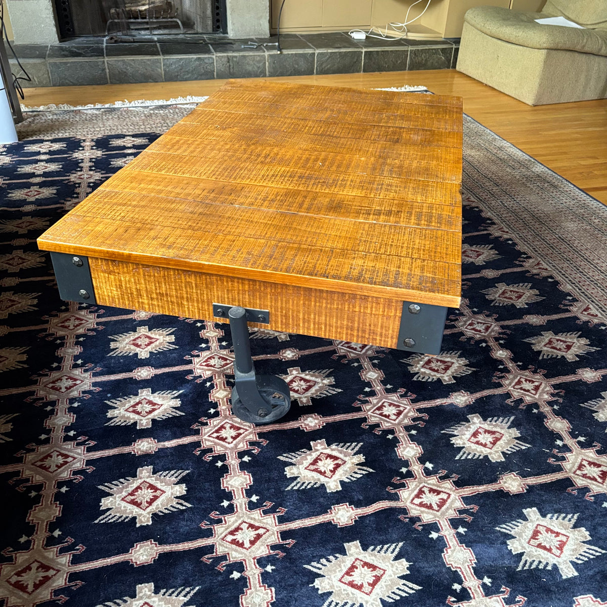 E128 Coffee table with industrial wheels (16” x 47” x 31”) **one wheel is slightly bent