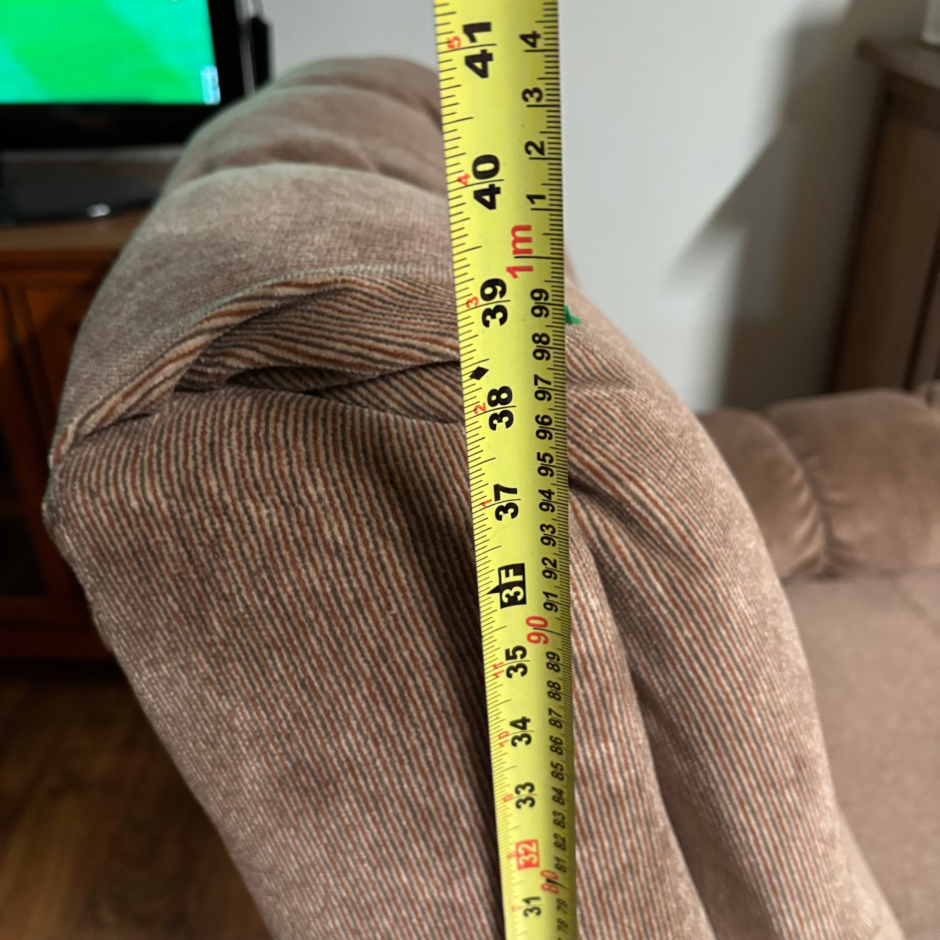 F188 Rocker recliner in beige corduroy fabric (in excellent condition except for a small tear in the corner)