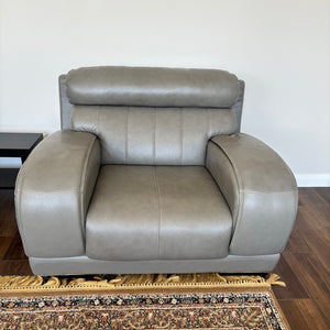Like new Grey Leather oversized chair with chrome trim on legs - R504