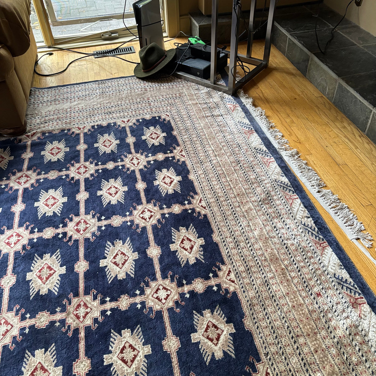 E129 109” x 150” Vintage wool rug with underlay (fringe is mostly separated)