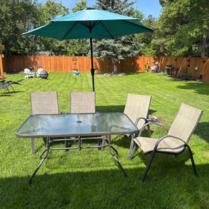 Glass Top Patio table, 4 chairs, umbrella and stand- M100