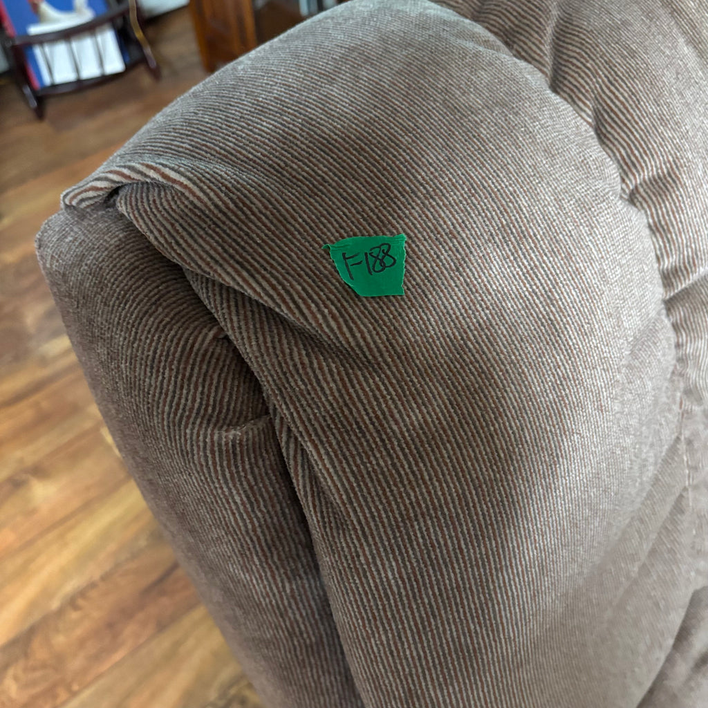 F188 Rocker recliner in beige corduroy fabric (in excellent condition except for a small tear in the corner)
