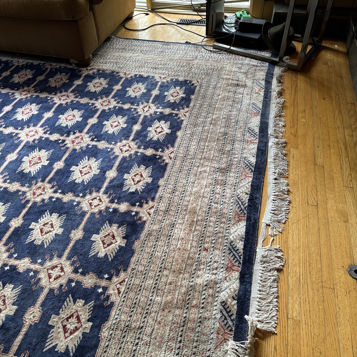 E129 109” x 150” Vintage wool rug with underlay (fringe is mostly separated)
