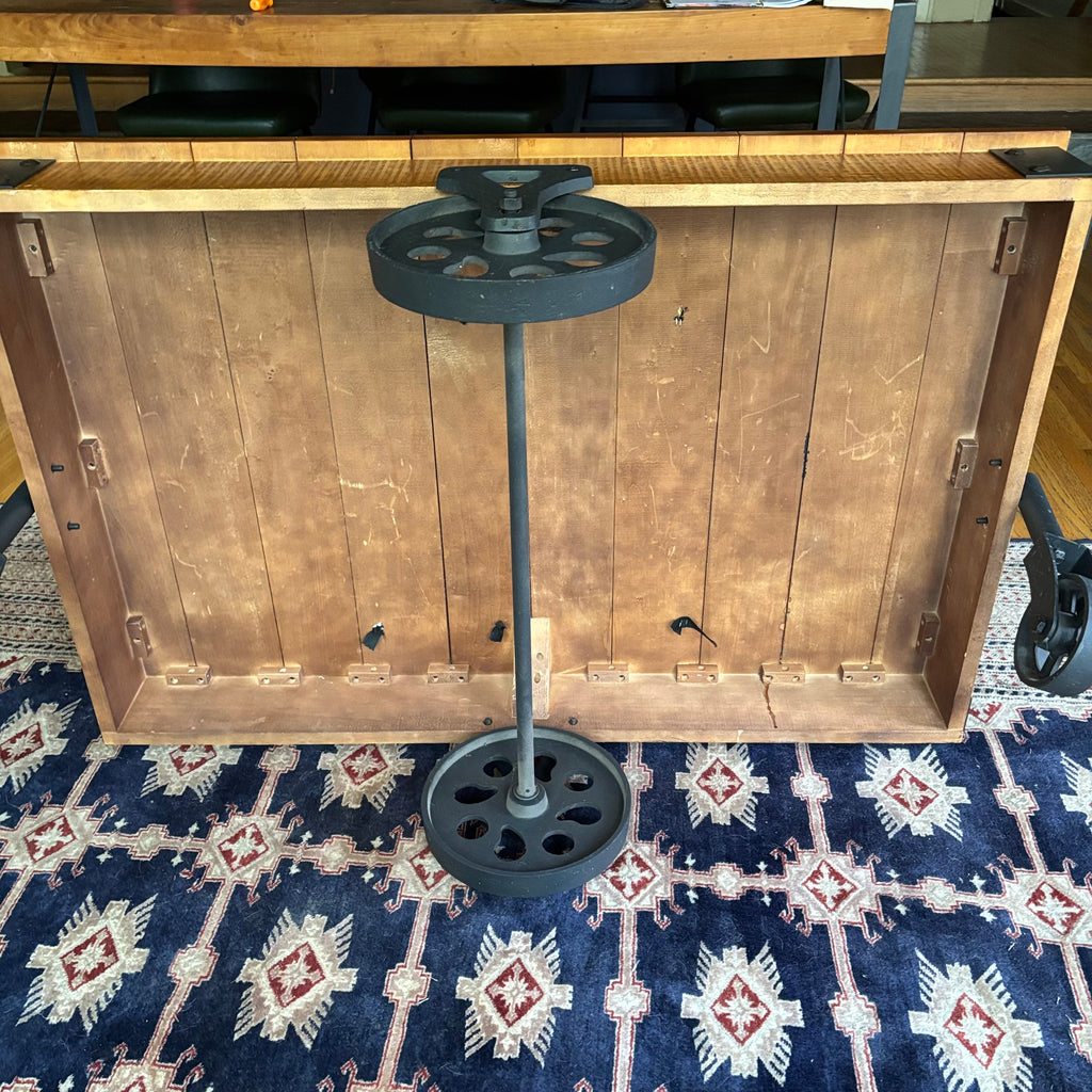 E128 Coffee table with industrial wheels (16” x 47” x 31”) **one wheel is slightly bent