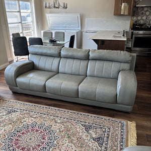 Like new Grey Leather sofa with chrome trim on legs - R507