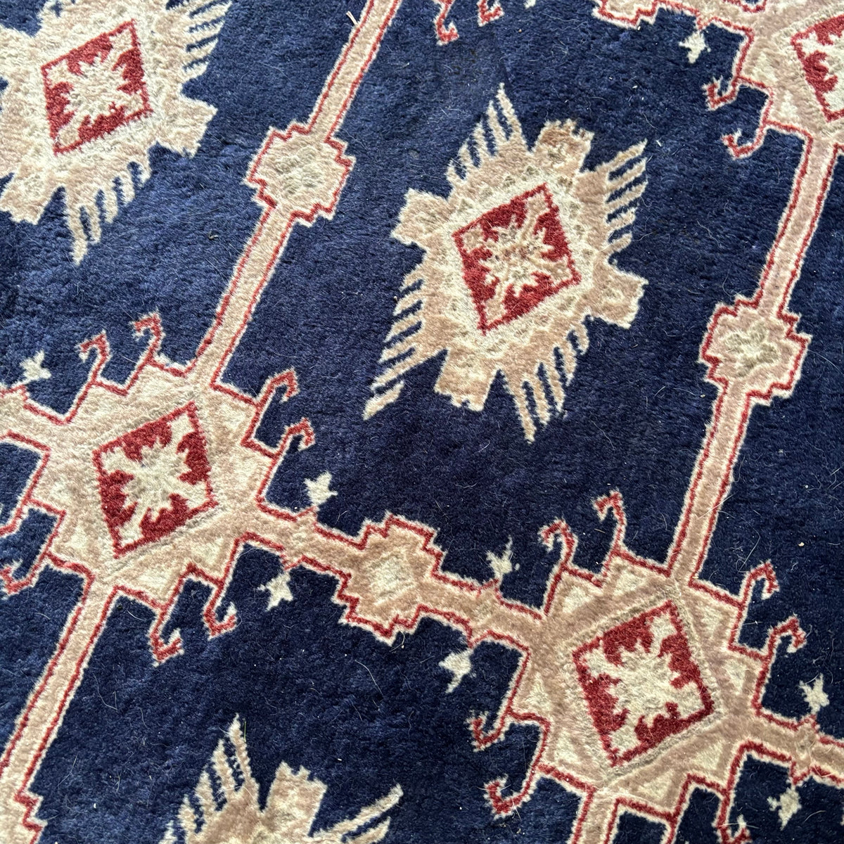 E129 109” x 150” Vintage wool rug with underlay (fringe is mostly separated)