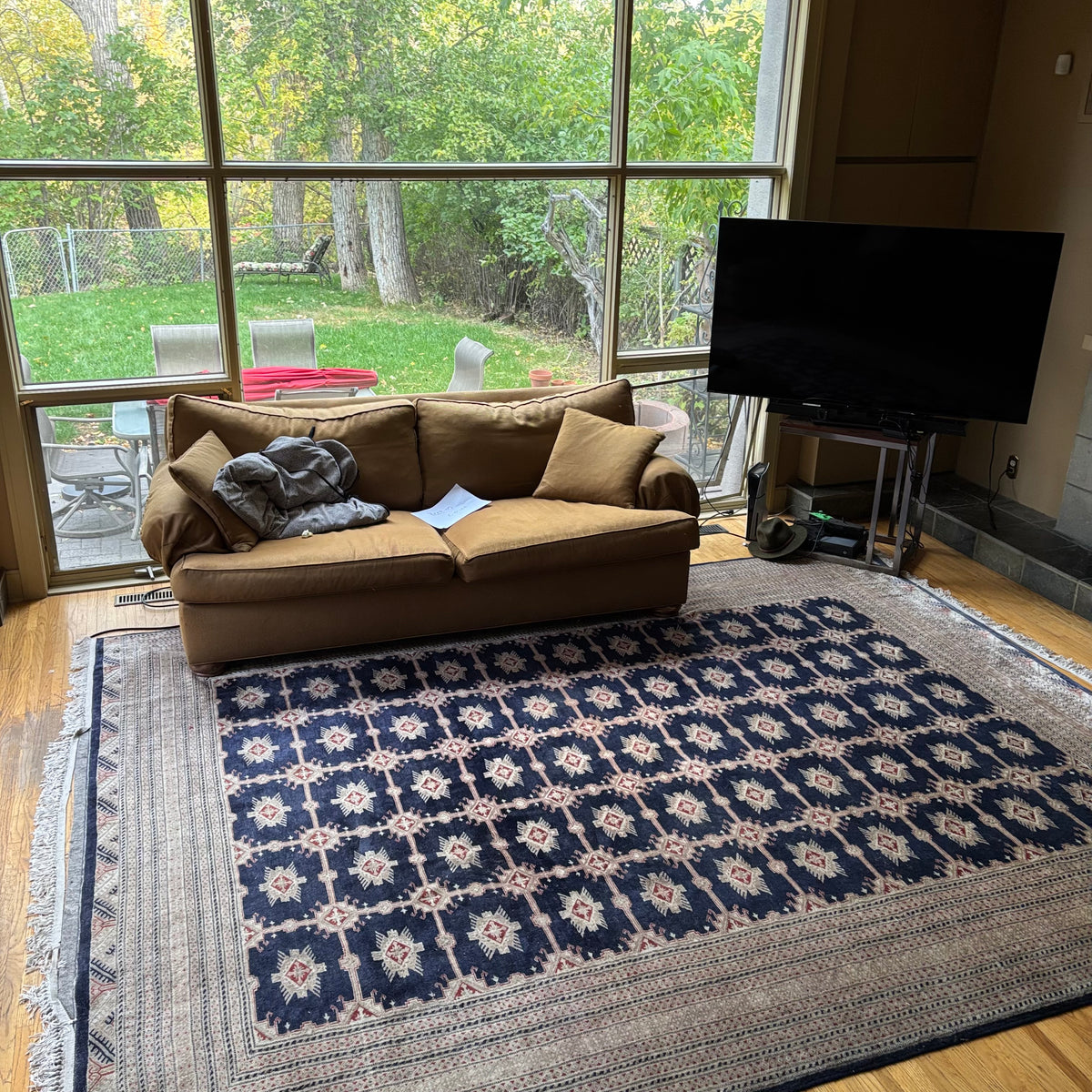 E129 109” x 150” Vintage wool rug with underlay (fringe is mostly separated)