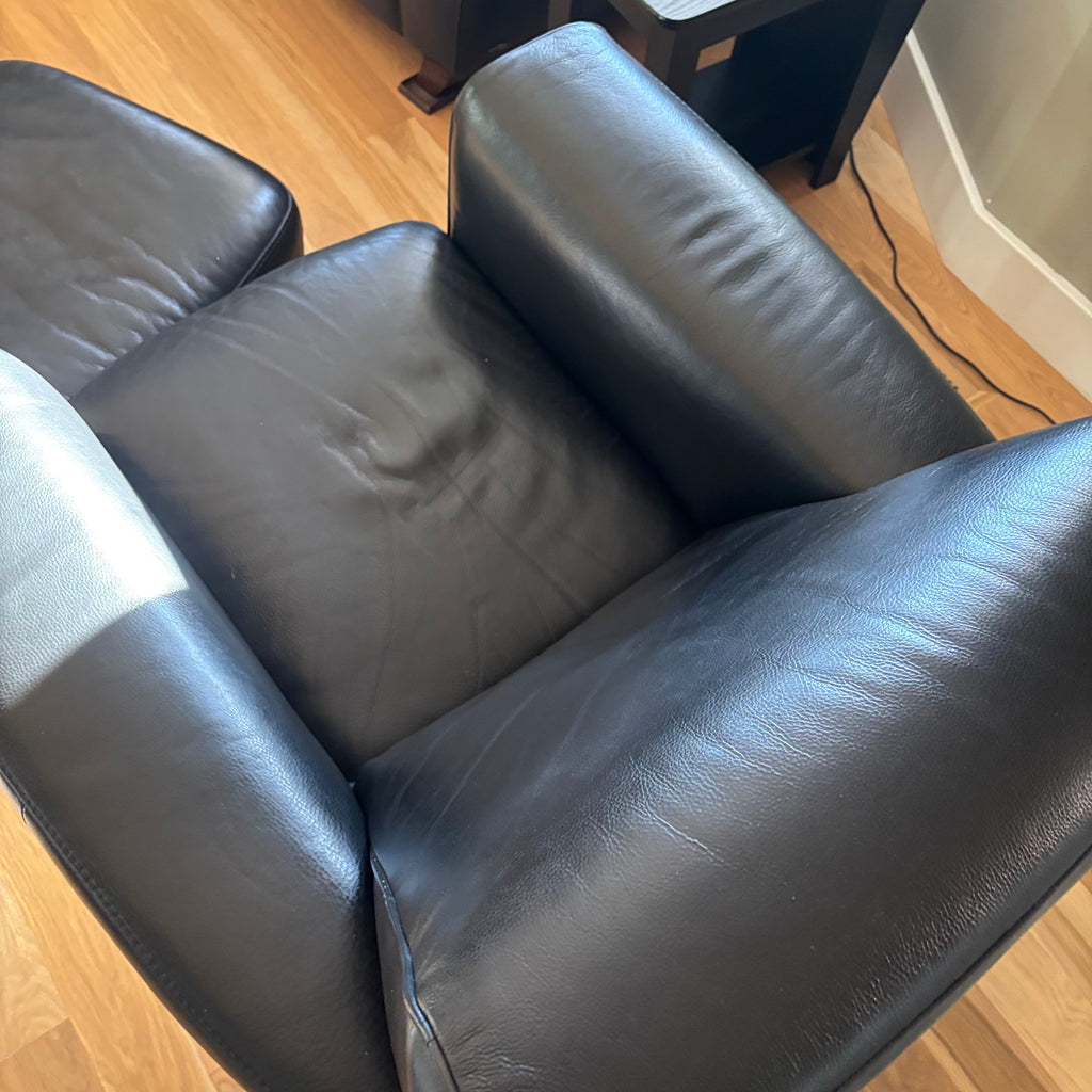 D100 Natuzzi Editions black leather arm chair and ottoman