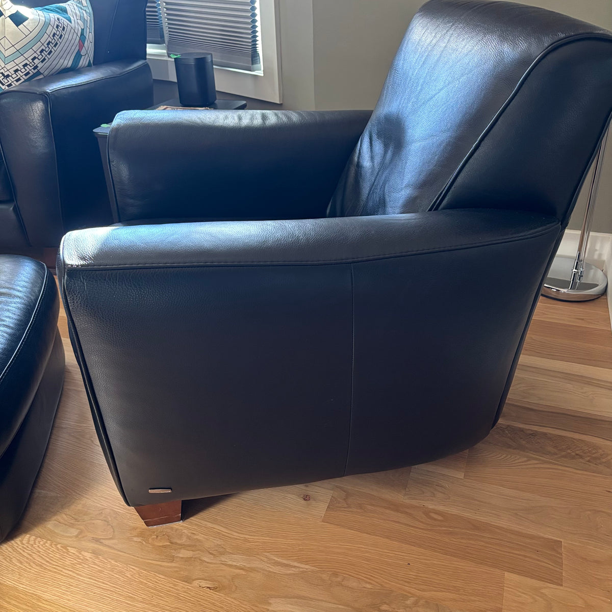 D100 Natuzzi Editions black leather arm chair and ottoman