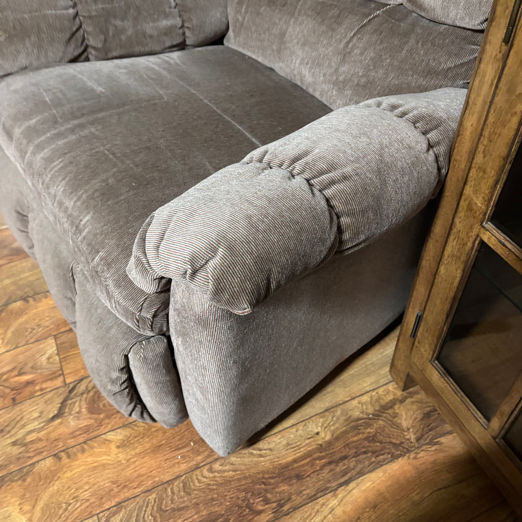 F188 Rocker recliner in beige corduroy fabric (in excellent condition except for a small tear in the corner)