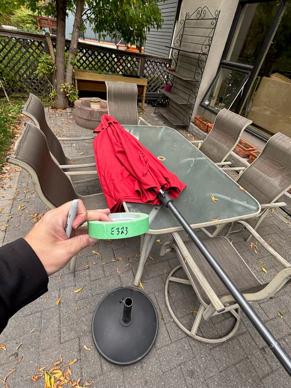 E323 Patio table with 6 chairs, red umbrella and umbrella stand